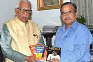Presenting my books to the U.P. Governor Mr Ram Naik at Raj Bhwan